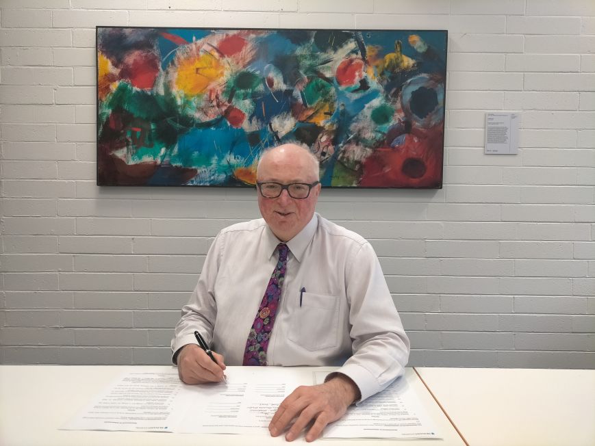 Executive Dean Horrigan signing the MULIA MoU