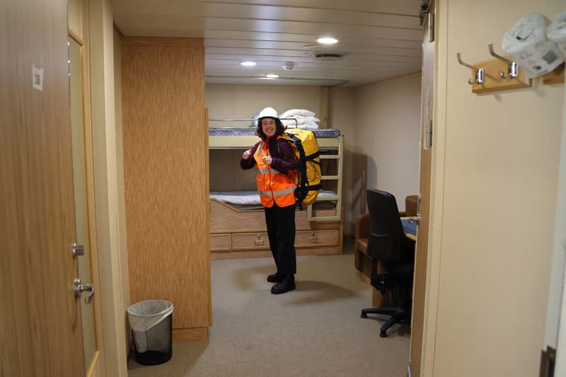 Amelia Pearson wearing safety gear in bunk room on board RV investigator