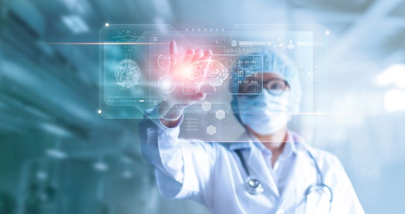 Doctor with hand up to a virtual screen