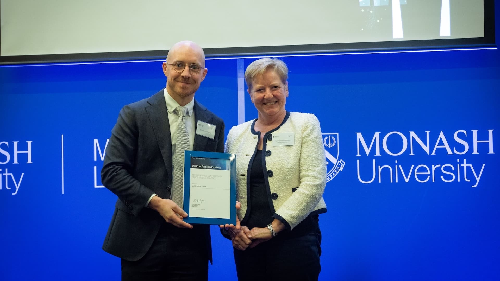 Simon Judd-Mole accepts his prize from Katherine Sampson of Mahlab Recruitment.