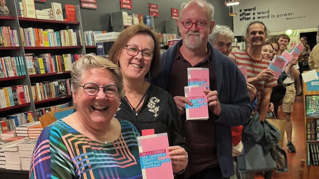 Paula Gerber at Readings with a queue of signature seekers