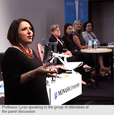 Professor Lyras speaking to the group of attendees at the panel discussion. 