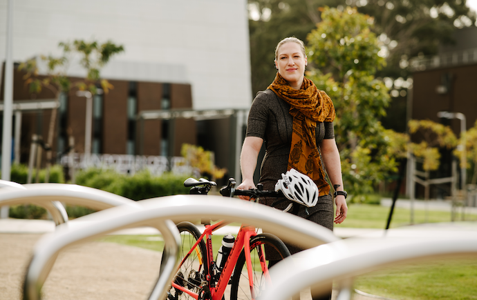 Woman standing near bike racks 