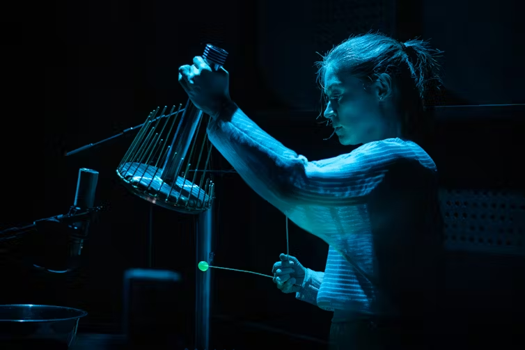 Performer Louise Devenish plays a waterphone. Darren Gill