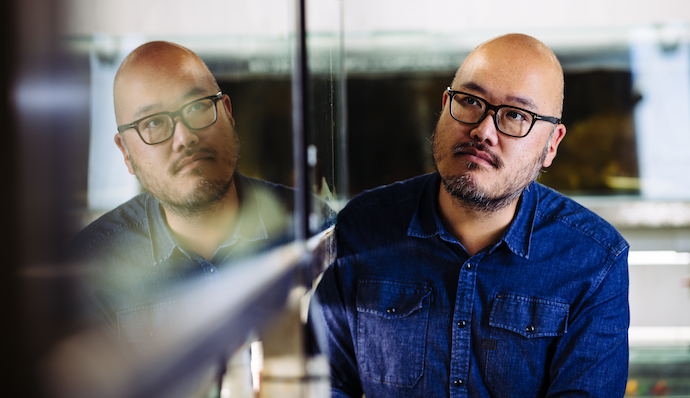 man looking into his own reflection