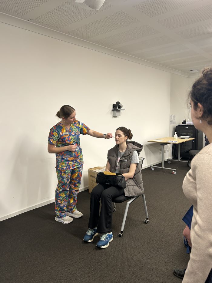 Monash medical students demonstrate a neurology examination
