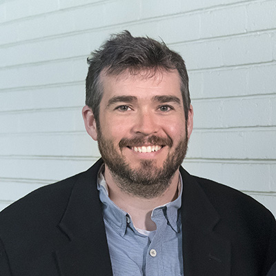 Dr Justin Adams 