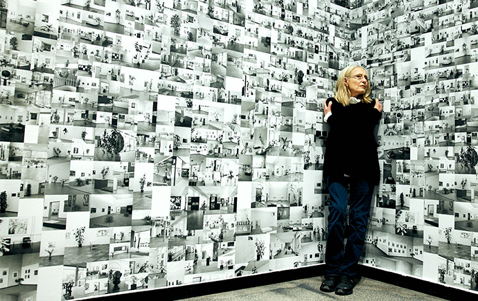 Dr Grazia Gunn poses with art.