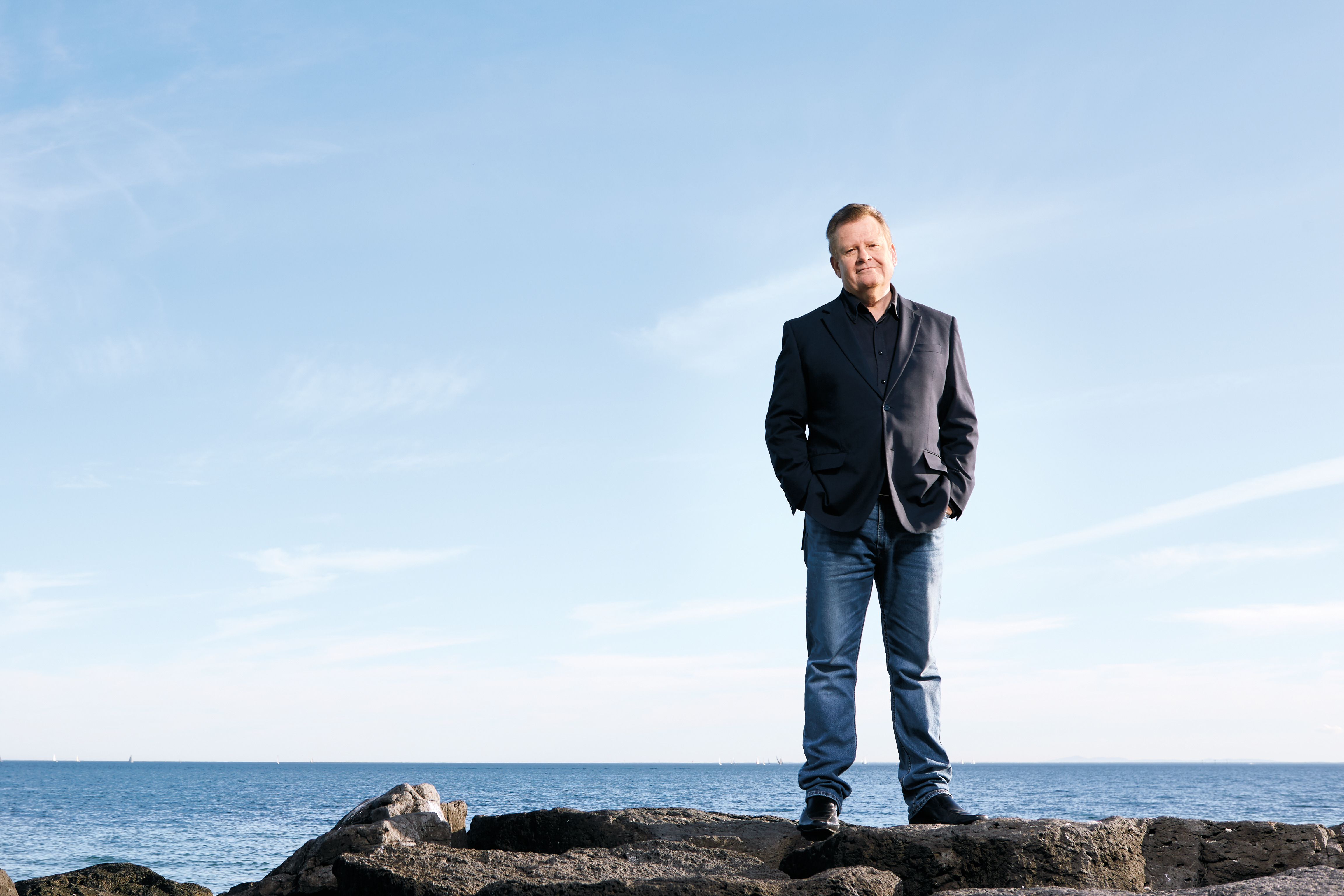 Paul Higgins standing on shoreline
