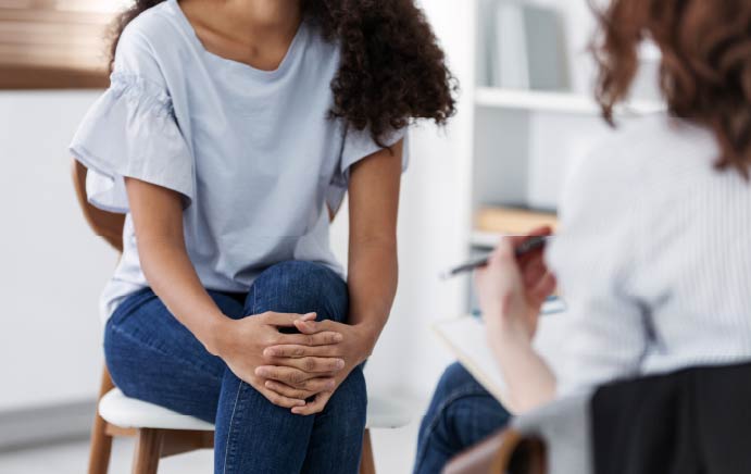 Anonymous photo of two women during a group psychotherapy session