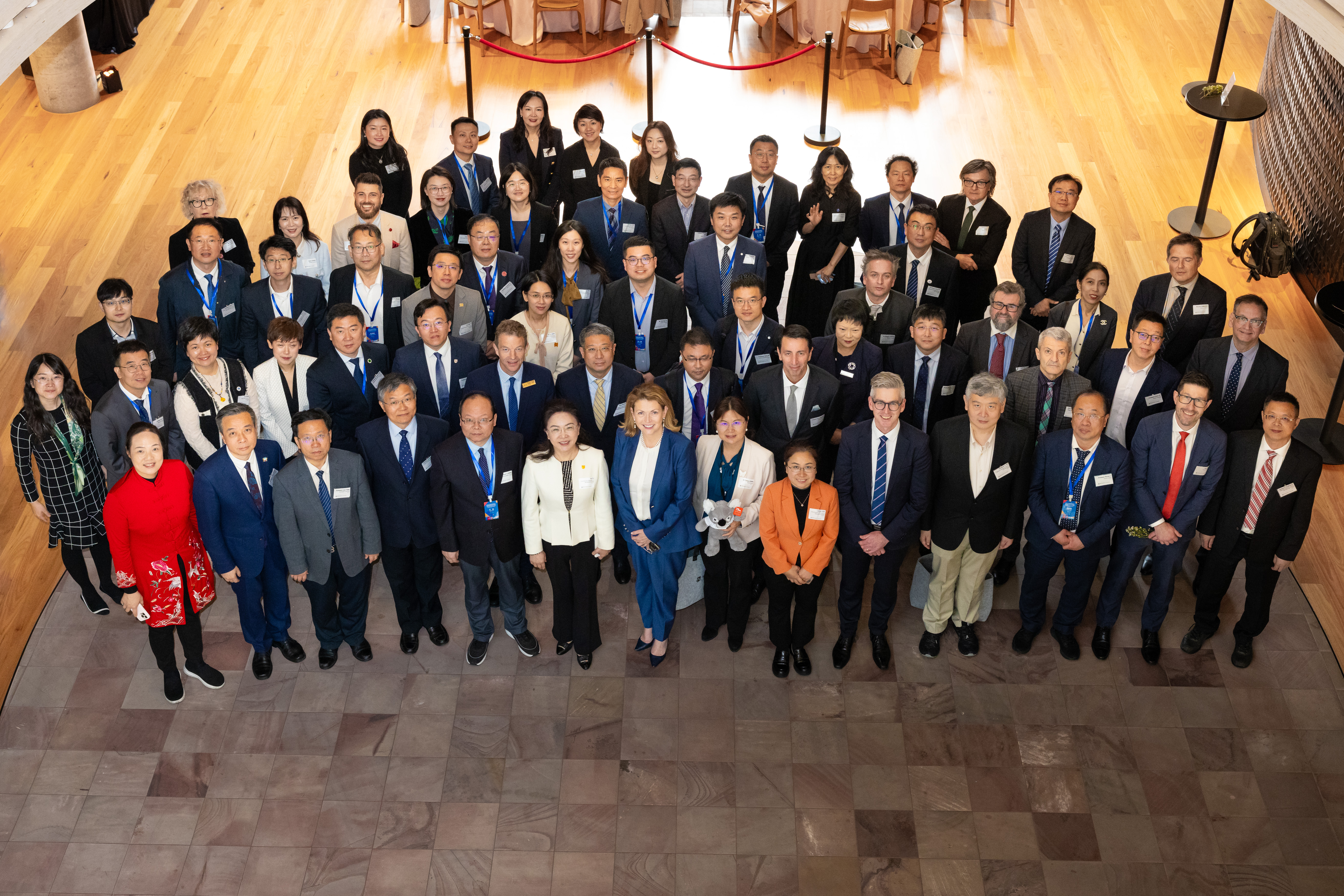 Top-down shot of the 40 Chinese Education Association for International Exchange delegation and Monash executive staff during the May 2024 visit 