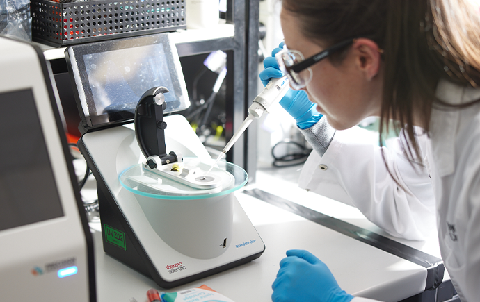 Dr Emily Pilkington checks the concentration of an mRNA product prior to packing it into a lipid nanoparticle formulation.