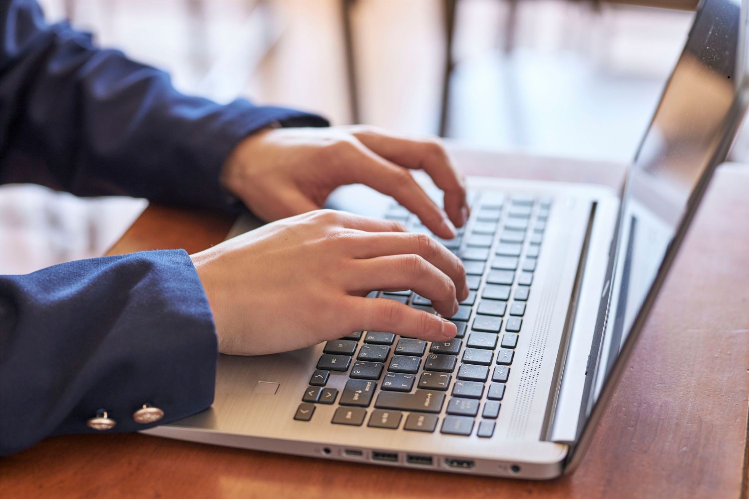 students-typing-on-the-keyboard-laptop