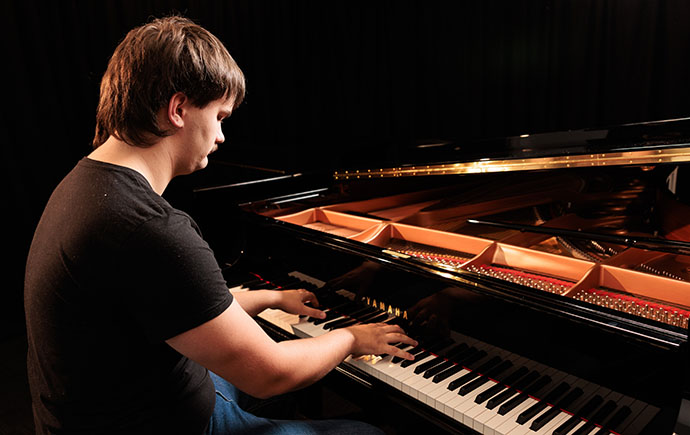 Lewis leans in to his calling to be both a musician and an educator