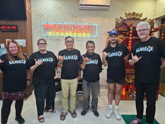 A group of people posing for a photoDescription automatically generated