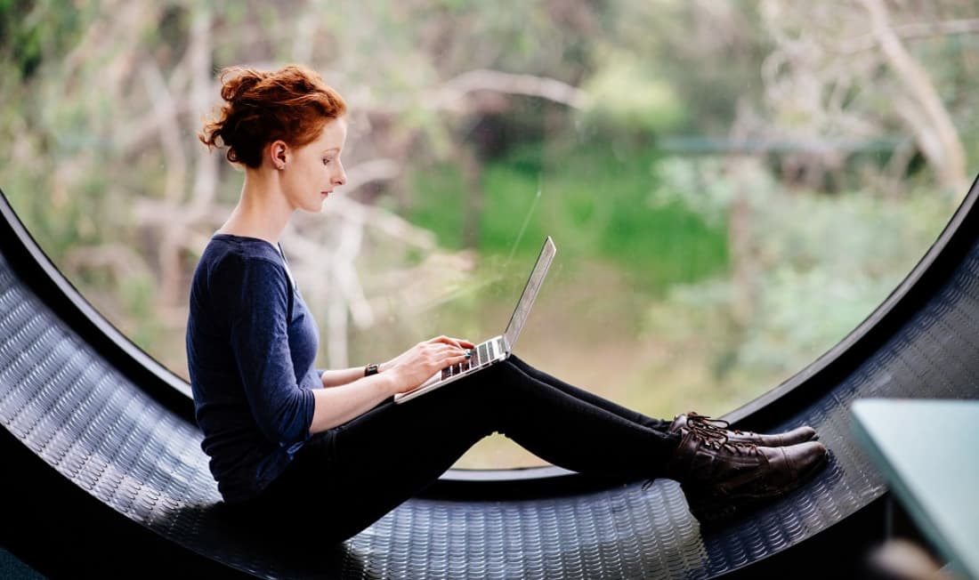 woman sitting in window