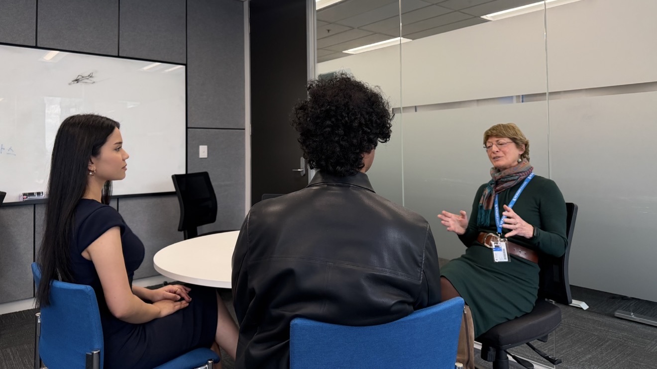 Nandira and Anubhav talking to Adjunct Professor Deborah Glass OBE