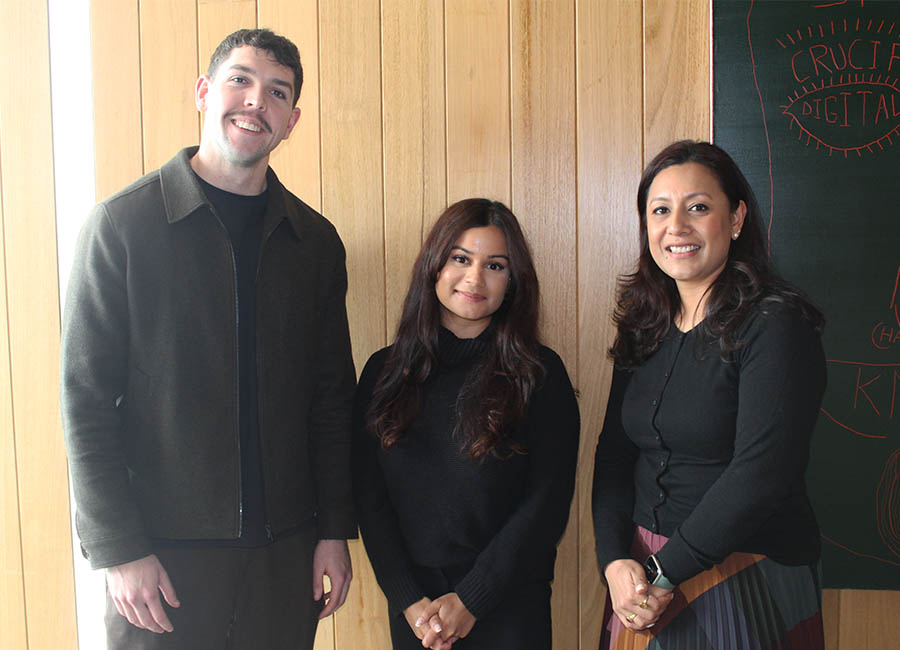 Monash Arts student advisors Joel, Bianca, and Divha standing together.