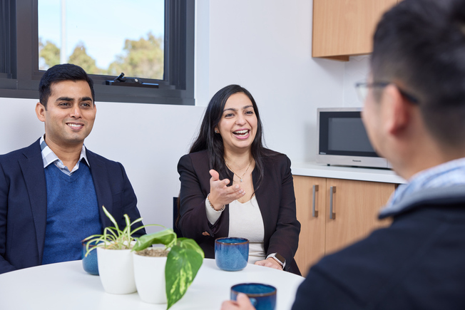 Scientists conversing in tearoom