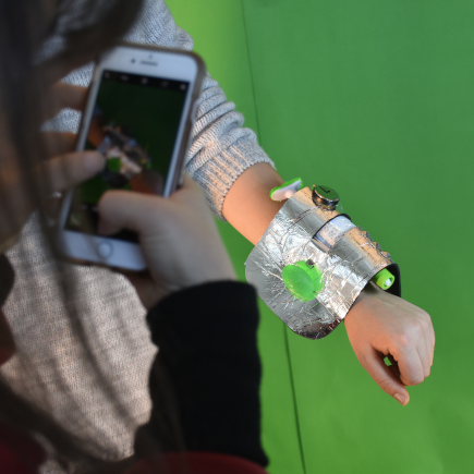 Students model and photograph a metallic wristband object