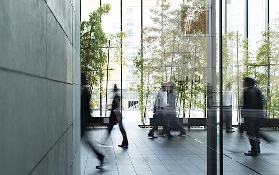 Business person walking in a urban building