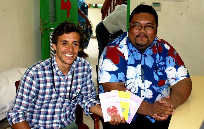 Alex Bongers donating resources to the Director of Health Dr Stephen Homasi