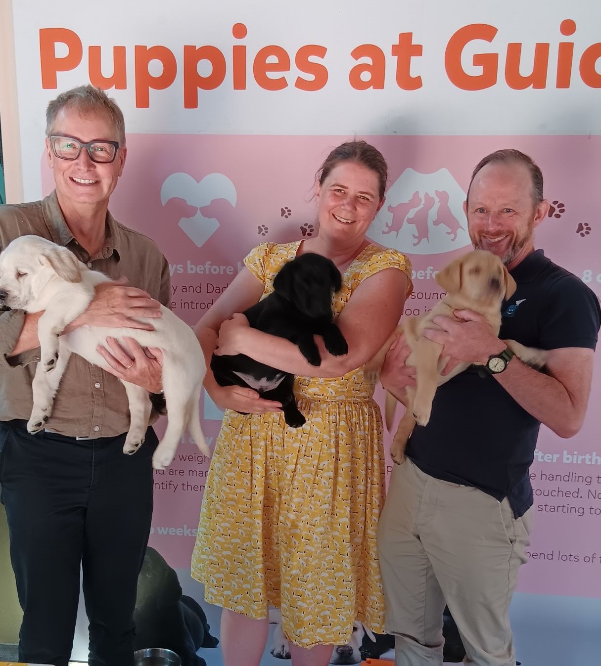 MATS members holding puppies at Guide Dogs Victoria