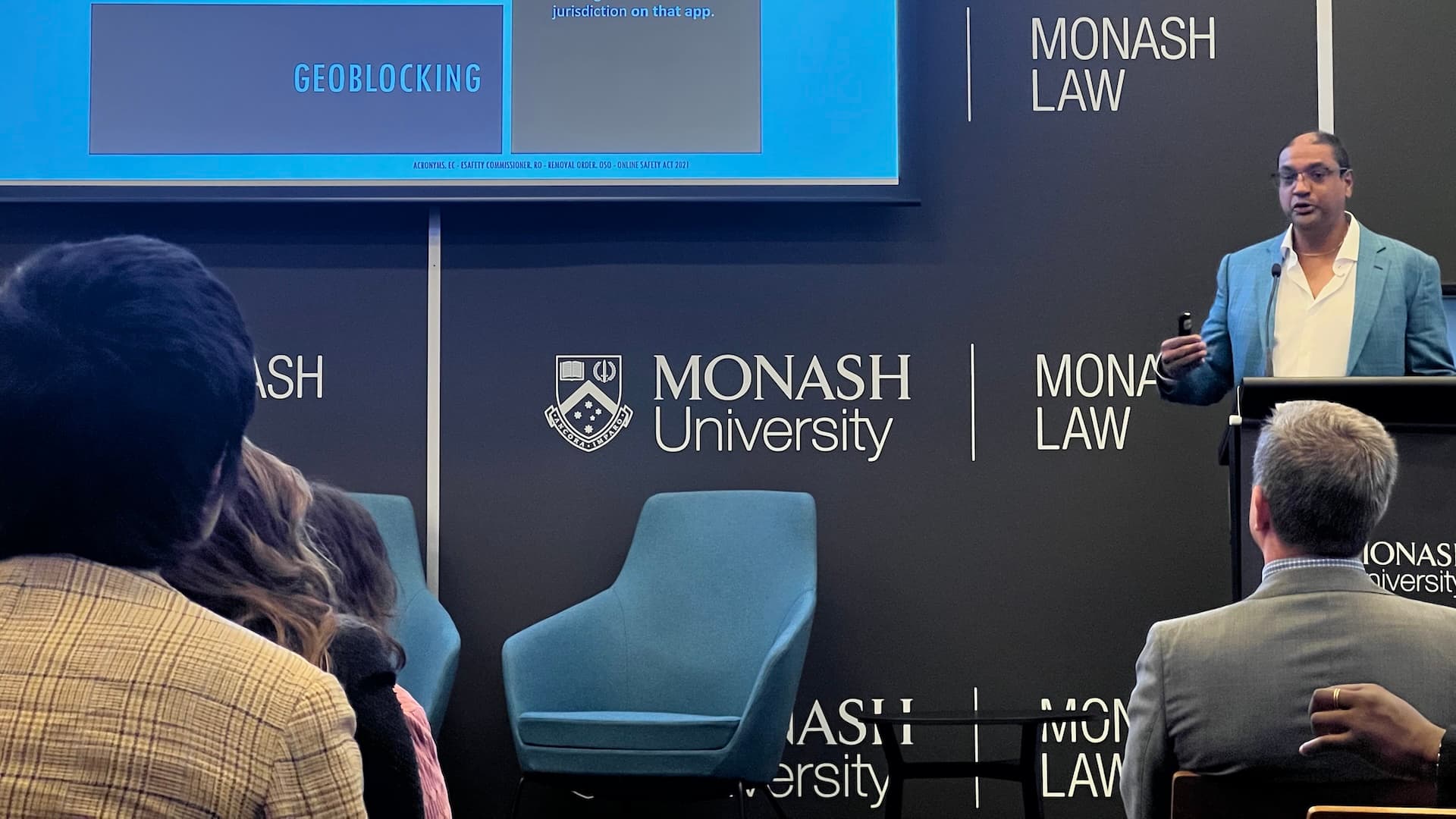 Dr Neerav Srivastava presenting at a lectern