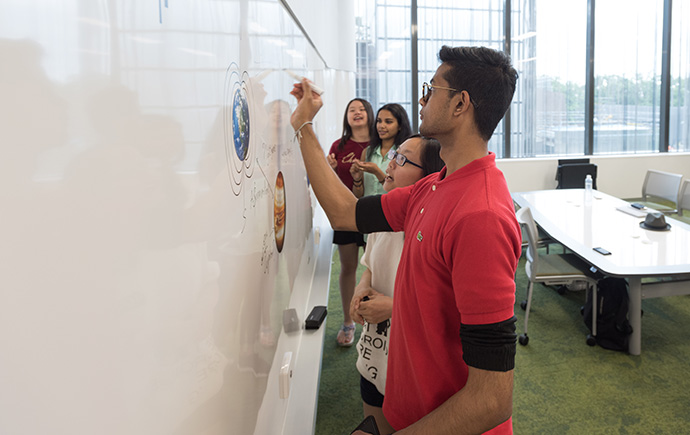 Student adds to whiteboard