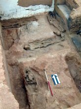 Lower burials situated in pits at the north end of Room 2.