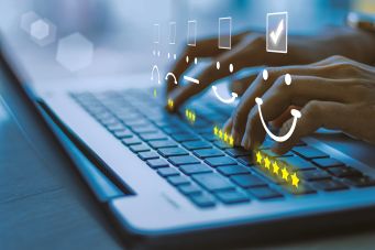 student pressing face emoticons on the keyboard laptop
