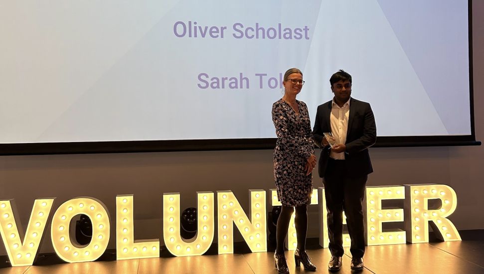 Oliver Scholast presented with Student Volunteer Award